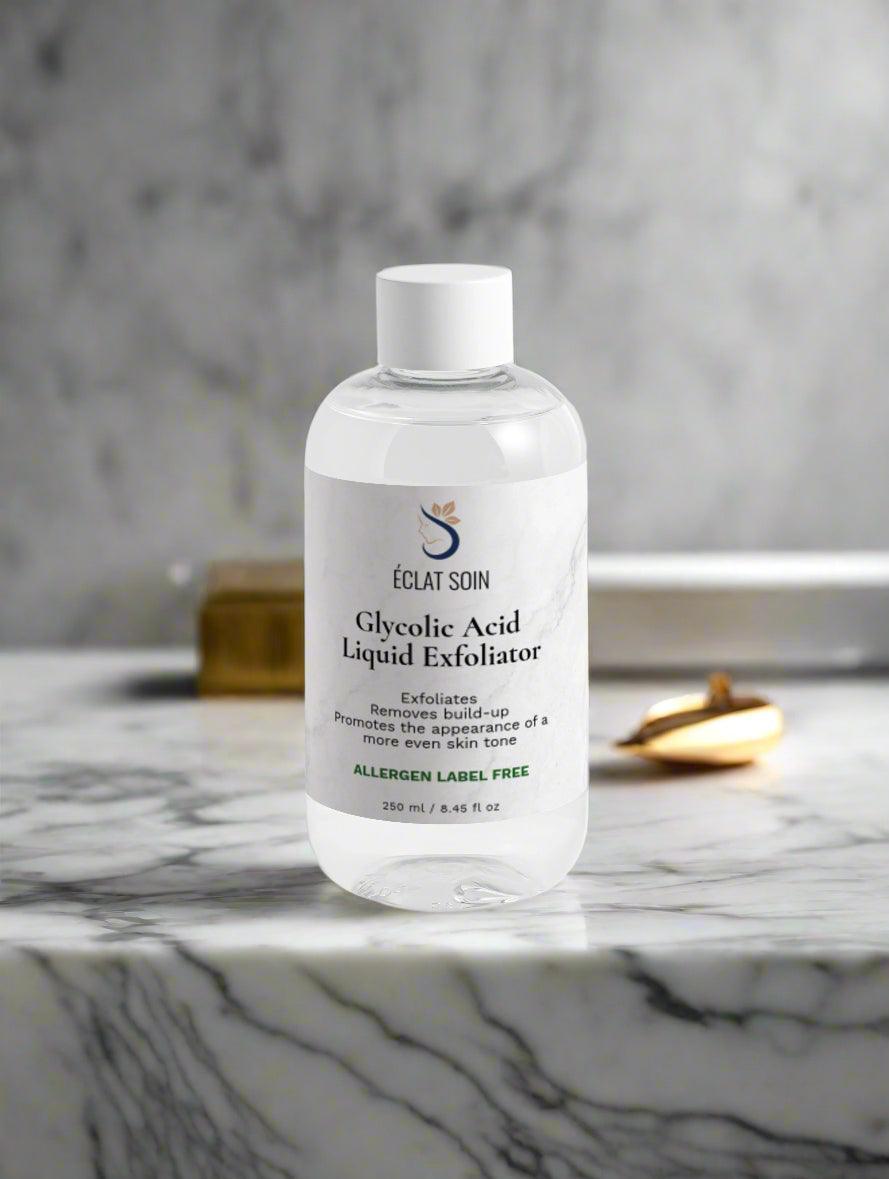 Eclat Soin Glycolic Acid Liquid Exfoliator in a clear bottle on a marble surface for smooth skin